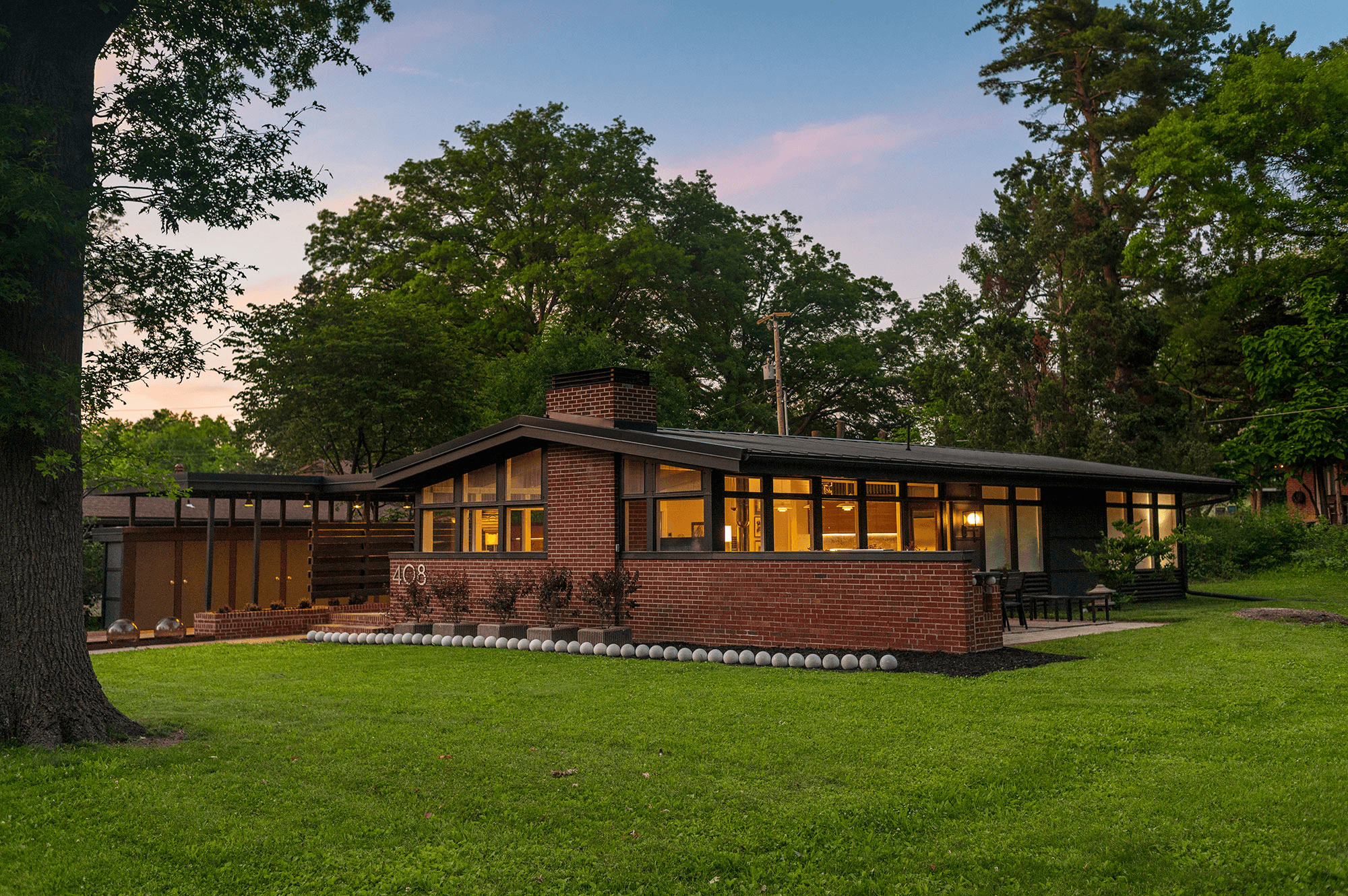 Leawood mid-century brick home exterior at dusk