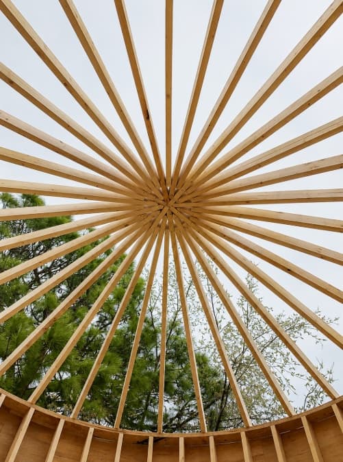 Radial wood roof framing in progress